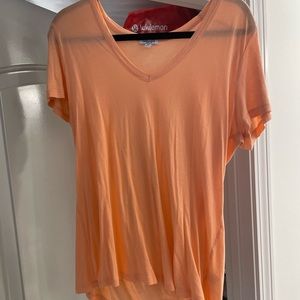 Peach colored v-neck tee